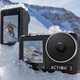Two DJI Osmo Action 3 action cameras sitting on the snow-covered side of a mountain.